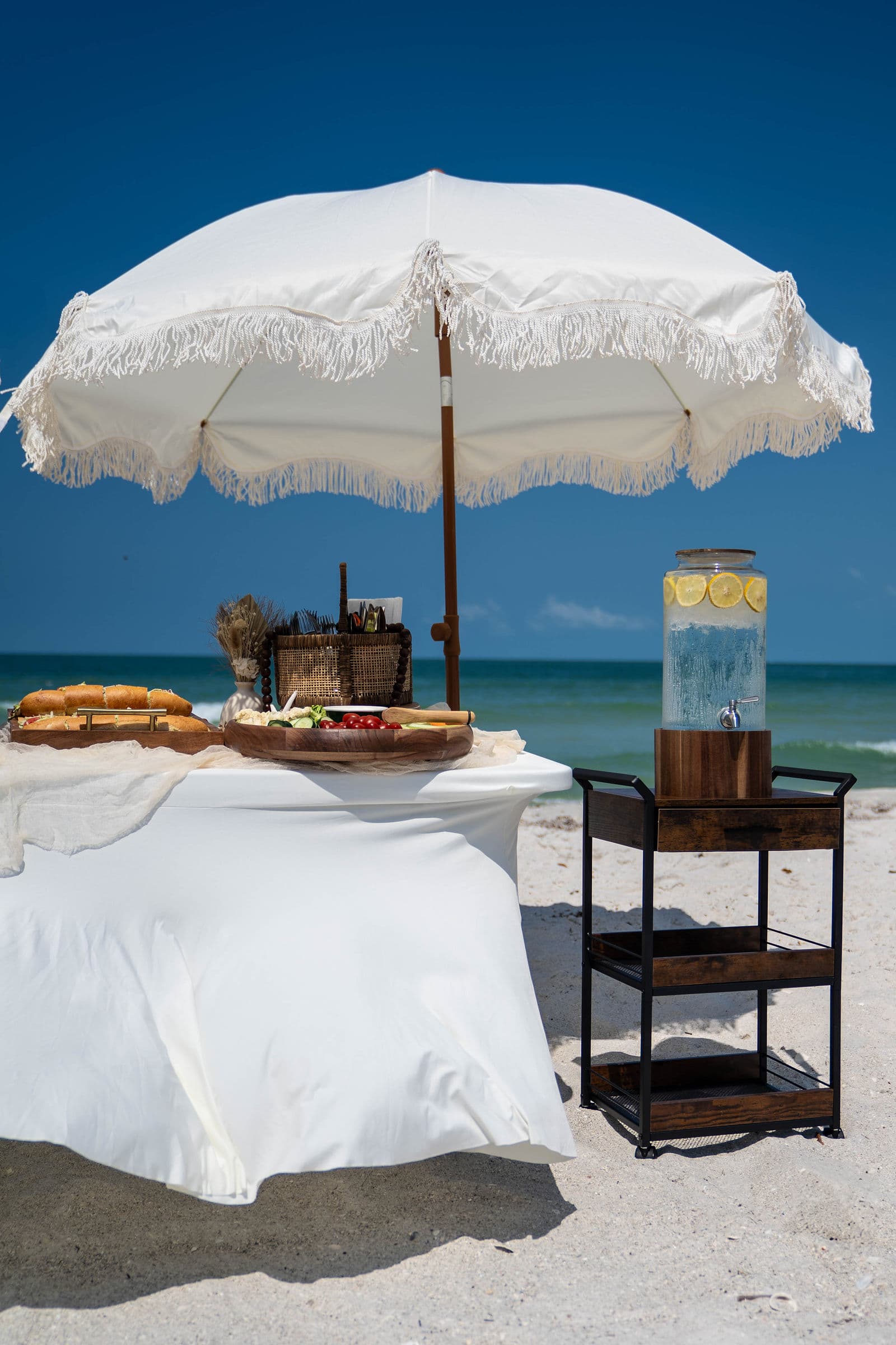 Beautiful Florida beach wedding ceremony with tropical floral arrangements, real Florida Weddings client photo