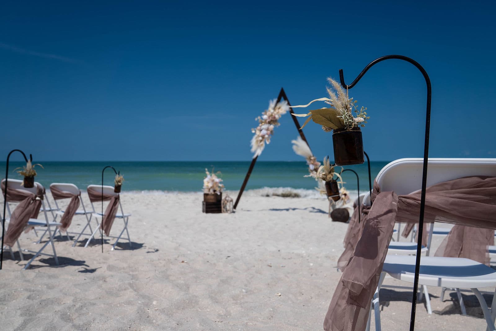 Florida beach wedding ceremony on white sand